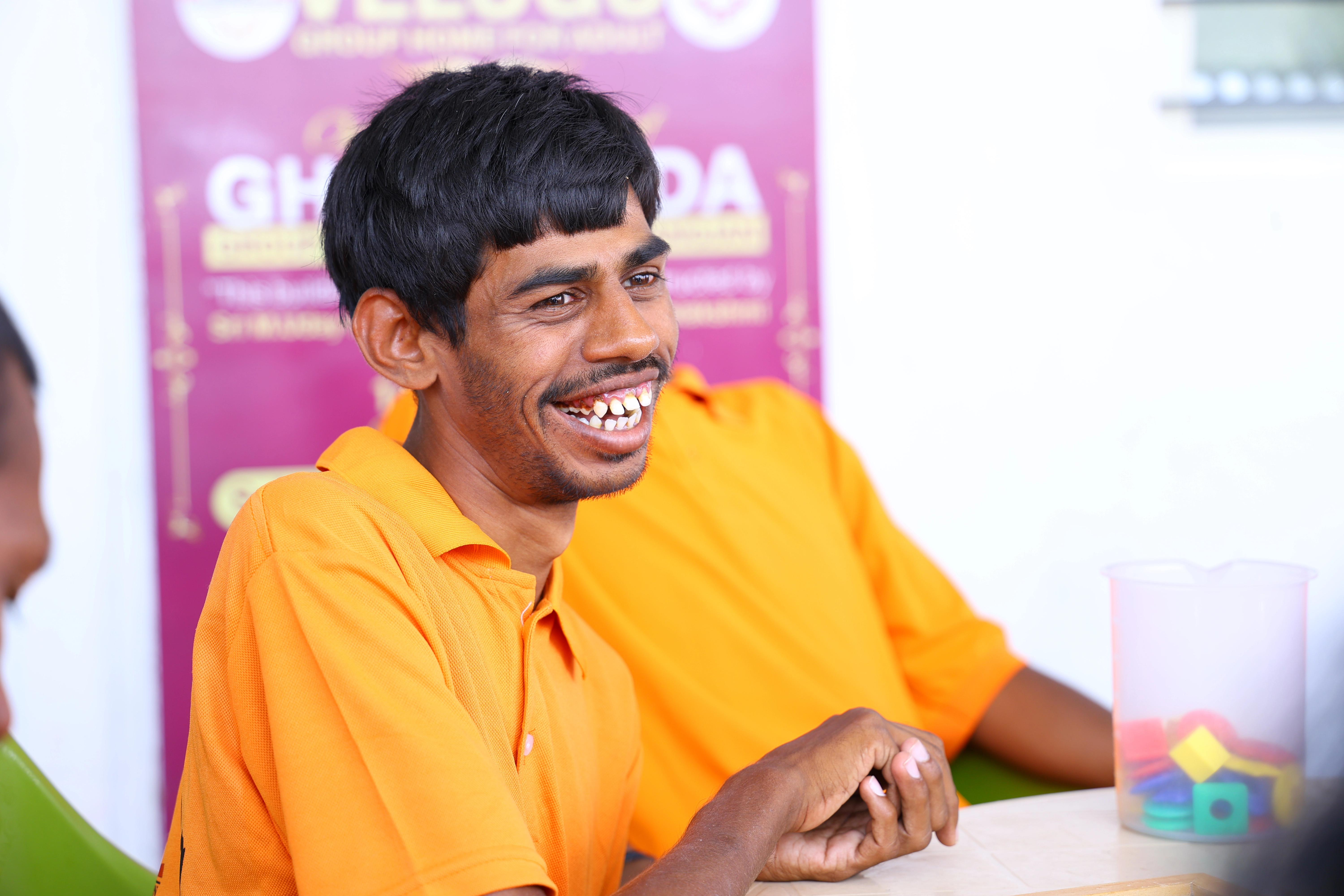 Children with mobility aids on the school steps