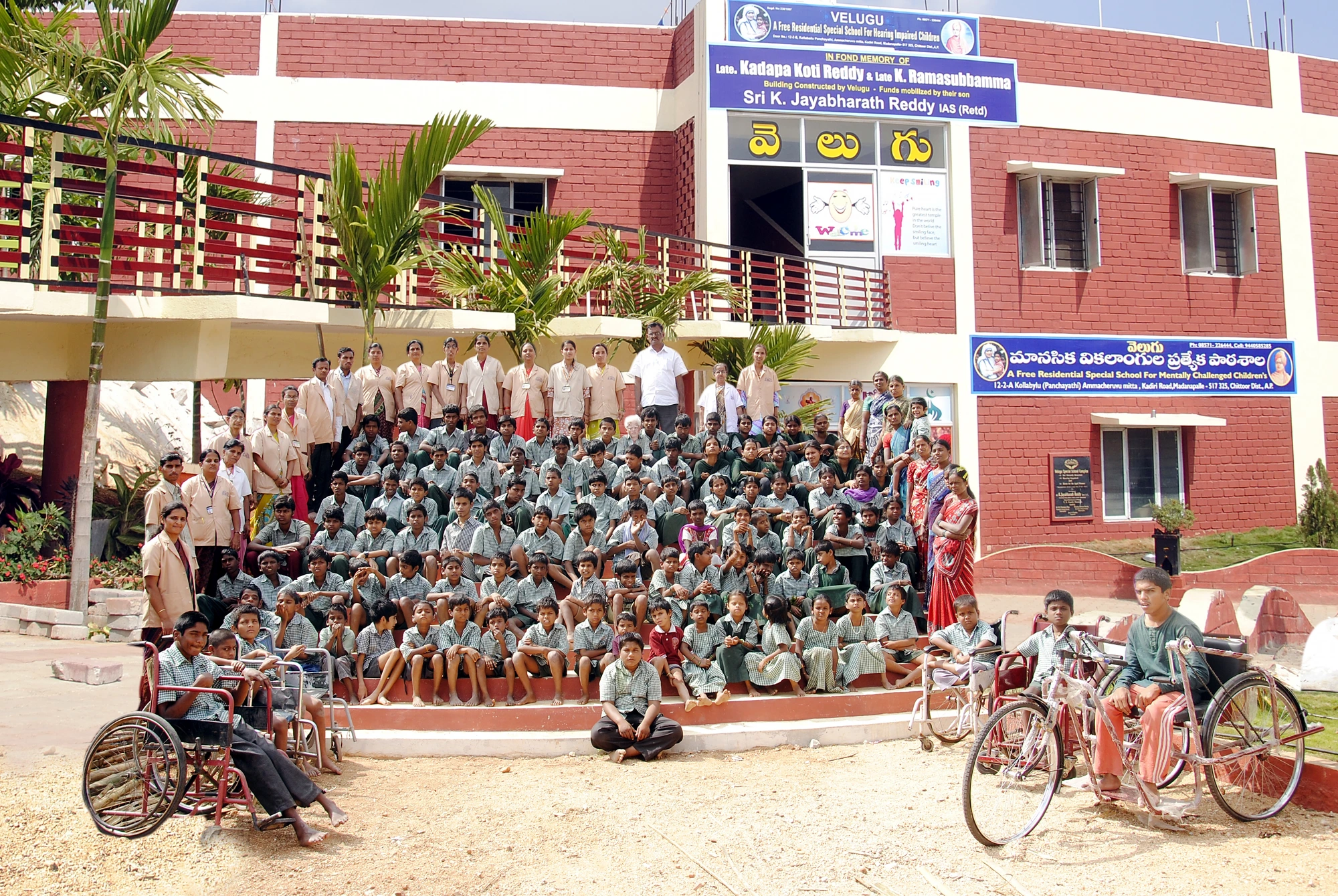 Children and staff of the Velugu special school in front of the campus building