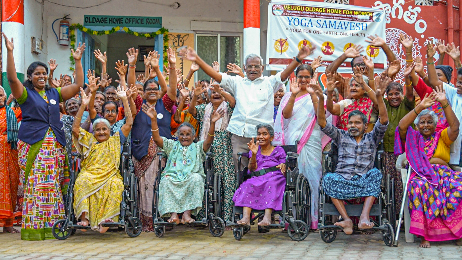 Elderly women and children together on the Velugu campus